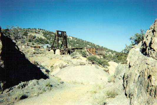 Locan Headframe and bins at Ruby Hill.  The train route ran through the area shown in the foreground.  This headframe fell due to age and weather in the winter of 2008-2009.  Connie Hicks photo.